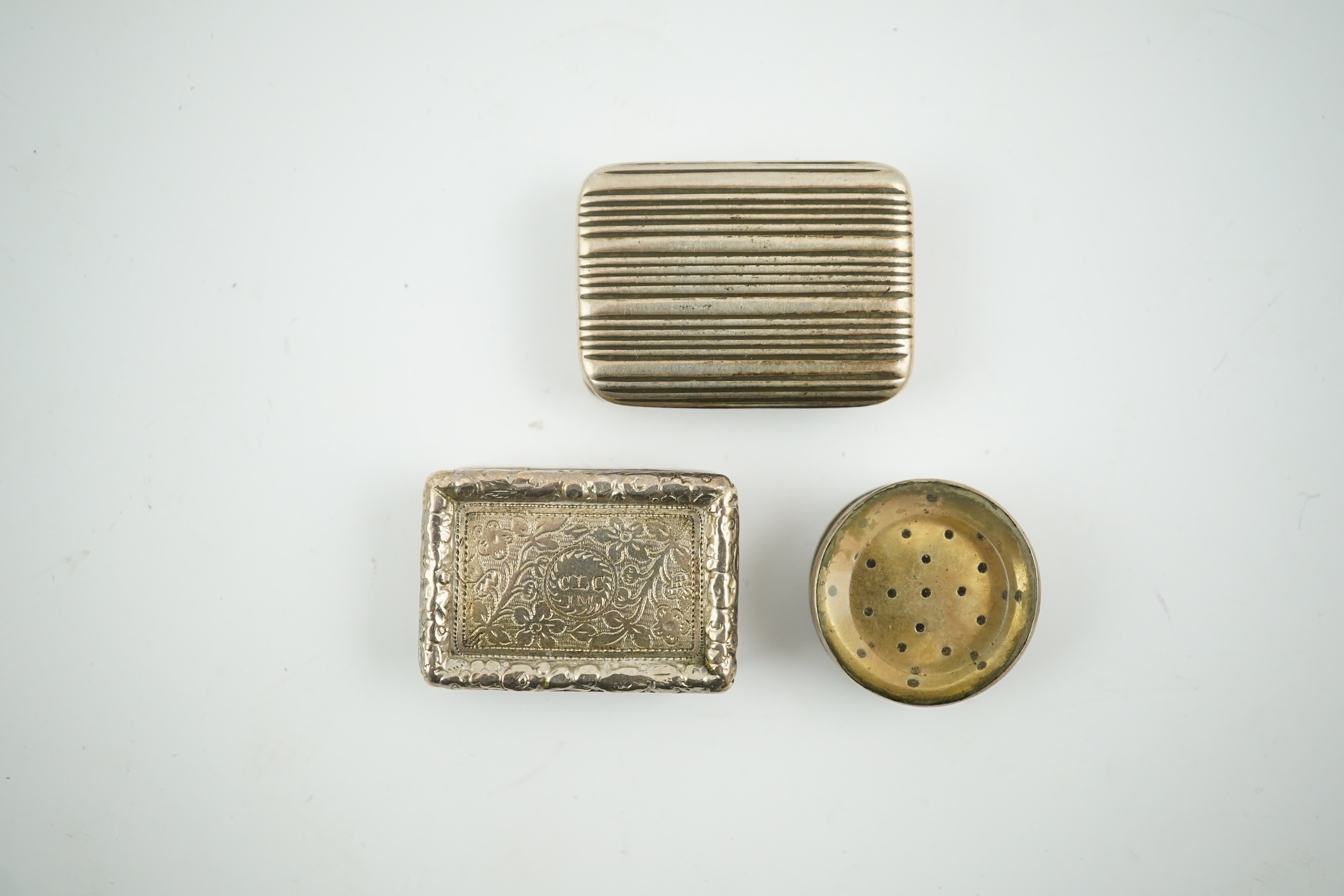 A William IV silver rectangular vinaigrette, William Stroud, Birmingham, 1833, 30mm and two other vinaigrettes. Condition - poor to fair